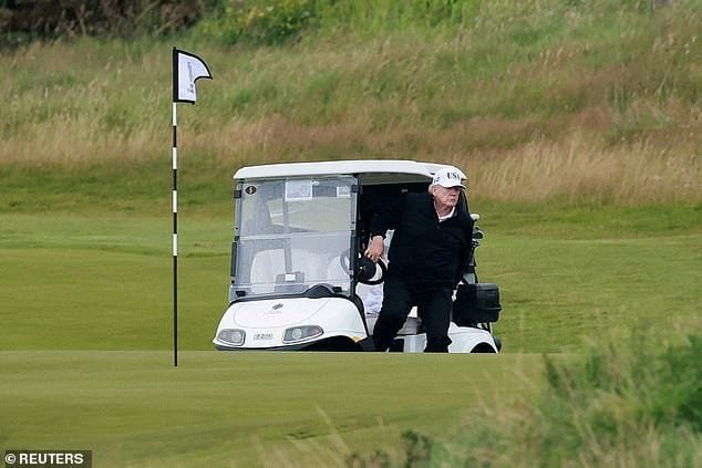 100669495-14944529-Trump_walks_out_of_a_golf_cart_at_Trump_Turnberry_resort_in_Turn-a-3_1753608847663.jpg
