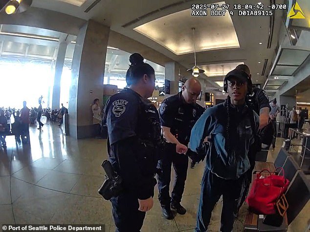 101198409-14998079-Fresh_bodycam_footage_shows_the_moment_sprinter_Sha_Carri_Richar-a-6_1755136993008.jpg
