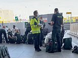 101952555-0-Emergency_crews_could_be_seen_putting_on_protective_white_suits_-a-28_1757432390104.jpg