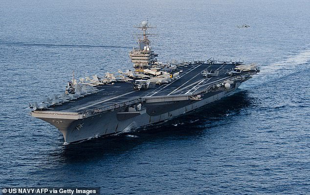 106296843-15557803-The_USS_Abraham_Lincoln_along_with_a_strike_group_is_currently_s-a-9_1770994822734.jpg