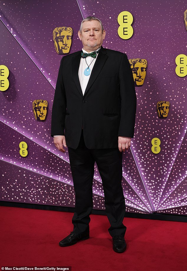 106664749-15590503-John_Davidson_at_the_Bafta_Film_Awards_at_the_Royal_Festival_Hal-a-7_1772020415010.jpg