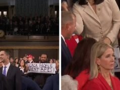 El representante Al Green sostiene el cartel de «Los negros no son monos» durante el discurso sobre el Estado de la Unión