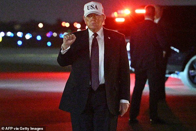 106757205-15602133-US_President_Donald_Trump_makes_a_fist_after_he_steps_off_Air_Fo-a-11_1772322996148.jpg