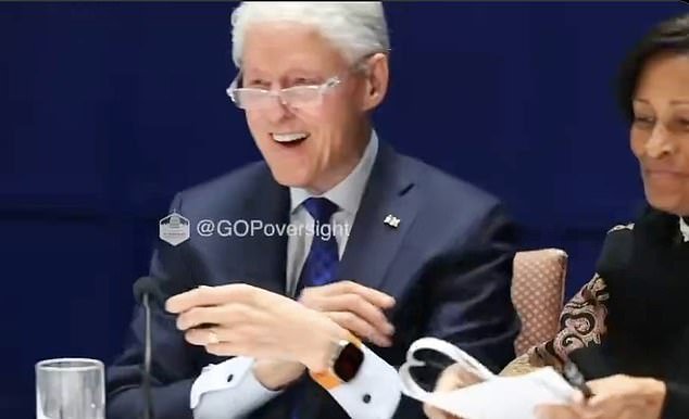 106833935-15609611-Bill_Clinton_and_his_attorney_shared_a_knowing_smirk_after_the_f-a-18_1772552393209.jpg
