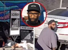 El hermano de Nipsey Hussle se cubre mientras filma el video de la inauguración del restaurante